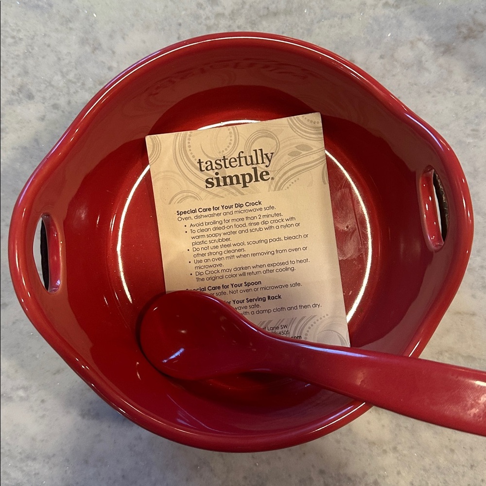 Tastefully Simple Dip Crock with resting spoon.